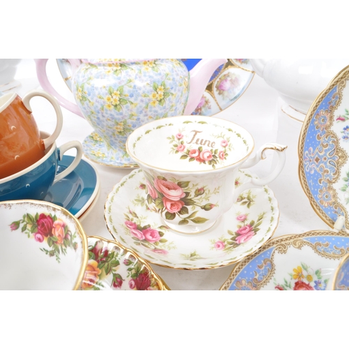 135 - A collection of vintage 20th-century fine bone china teapots, cups, and saucers. To include: Paragon... 