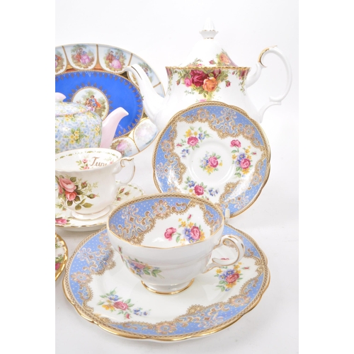 135 - A collection of vintage 20th-century fine bone china teapots, cups, and saucers. To include: Paragon... 