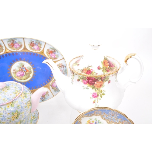 135 - A collection of vintage 20th-century fine bone china teapots, cups, and saucers. To include: Paragon... 