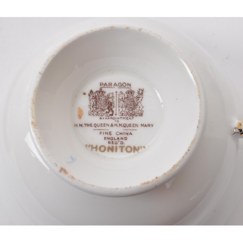 135 - A collection of vintage 20th-century fine bone china teapots, cups, and saucers. To include: Paragon... 