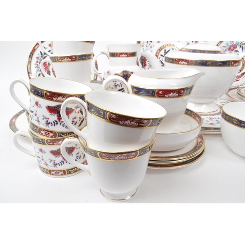 137 - Royal Worcester - Prince Regent - A collection of 1994 tea service pieces, including a teapot, cups,... 