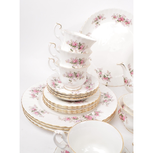 140 - Royal Albert - Lavender Rose - A collection of 1961 bone china tea service pieces, including a teapo... 