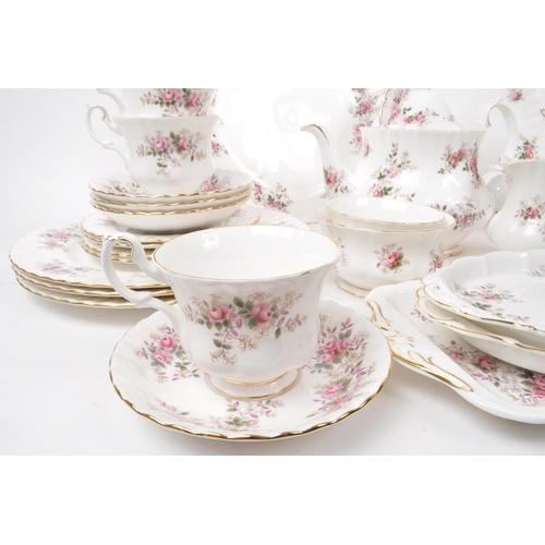 140 - Royal Albert - Lavender Rose - A collection of 1961 bone china tea service pieces, including a teapo... 