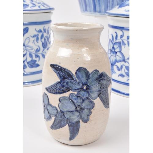 141 - A collection of five 20th-century Chinese porcelain/pottery pieces, each with a blue and white flora... 