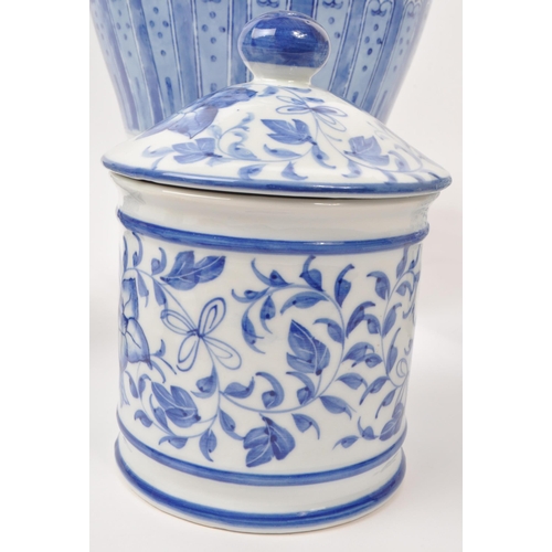 141 - A collection of five 20th-century Chinese porcelain/pottery pieces, each with a blue and white flora... 