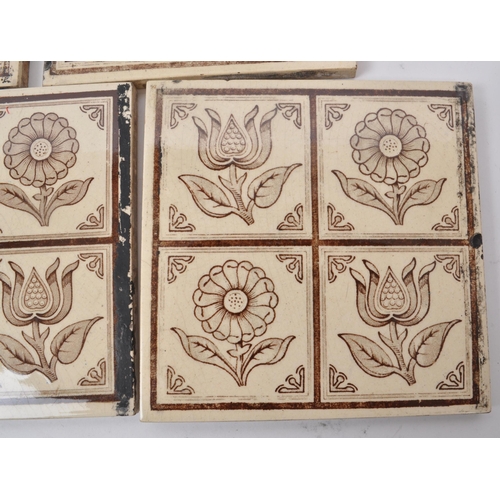 145 - A collection of ten Victorian aesthetic period ceramic tiles, featuring brown and cream-coloured flo... 