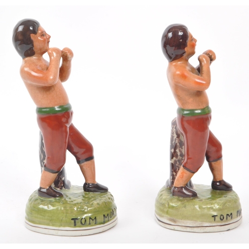 161 - Tom Molyneux - A pair of 19th century Staffordshire ceramic boxer figures. The figures each in the f... 