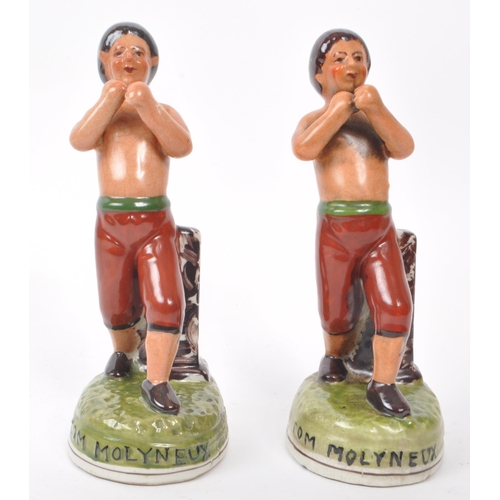 161 - Tom Molyneux - A pair of 19th century Staffordshire ceramic boxer figures. The figures each in the f... 