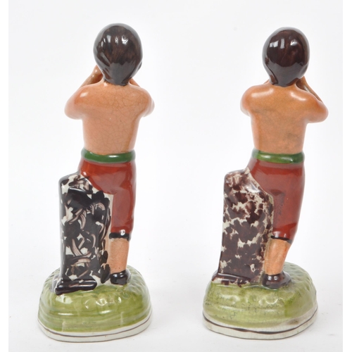 161 - Tom Molyneux - A pair of 19th century Staffordshire ceramic boxer figures. The figures each in the f... 