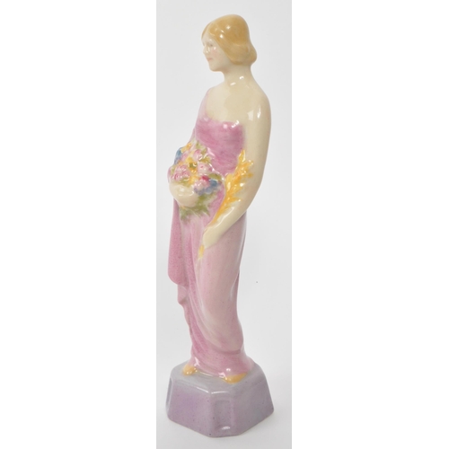 162 - Royal Doulton - An early 20th century 1902 - 1920 Royal Doulton HN314 Autumn porcelain figure. The f... 