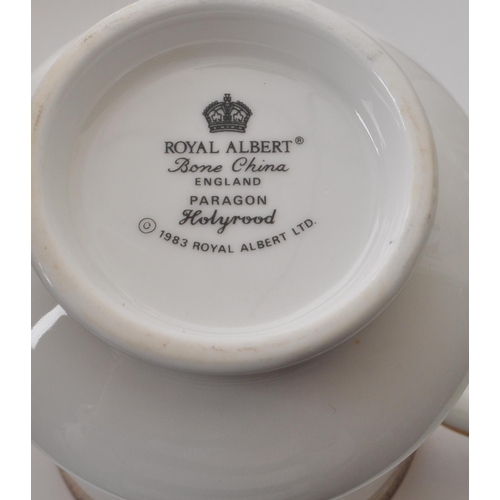 164 - Royal Albert - Holyrood - Paragon- A large collection of 1983 bone china tea and dinner services. To... 