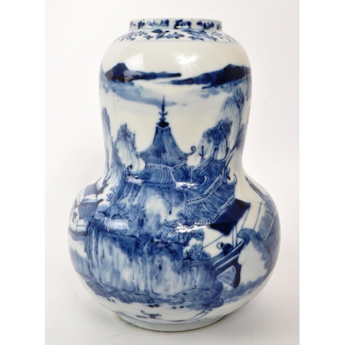 167 - A Chinese 19th century blue and white porcelain china vase. Depicinting a mountain side, with pagoda... 