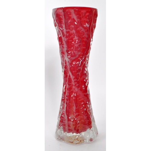 178 - A vintage 20th-century Whitefriars style red / maroon vase. It features a concave shape and bark eff... 