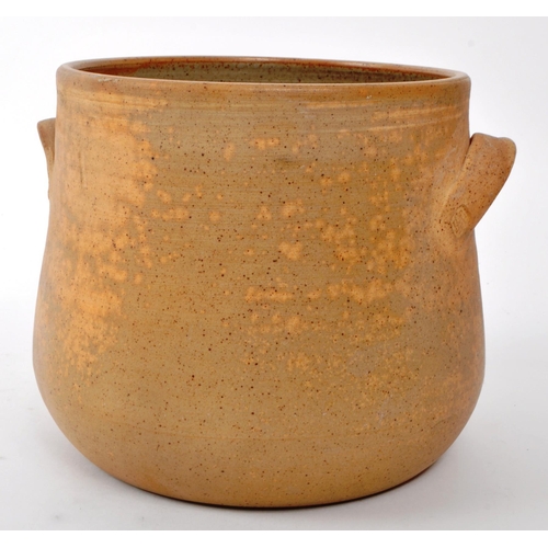 182 - Charlie Boyce - Aysgarth Pottery - A late 20th-century twin-handled squat vase, with a sand-coloured... 