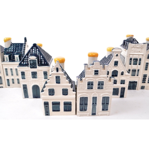 183 - KLM - BOLS - A collection of fourteen late 20th-century Blue Delft miniature liquor houses, sealed w... 