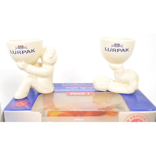 192 - Lurpak - A collection of vintage 20th century Lurpak ceramic egg cups. Each in original boxes, the c... 