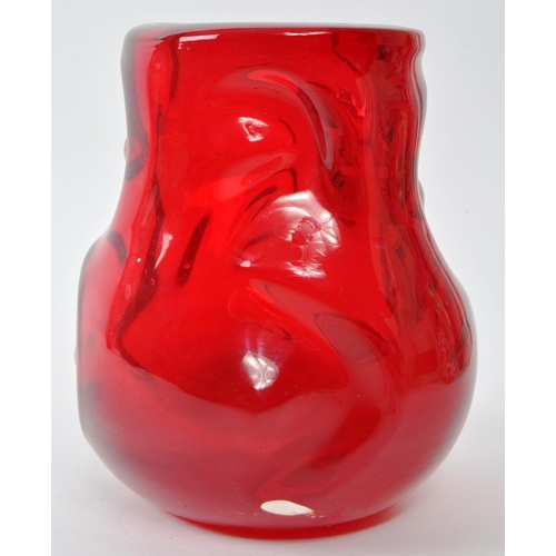 195 - A vintage mid-century Whitefriars 'knobbly' red art glass vase. Featuring an uneven, textured exteri... 