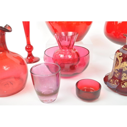 198 - A collection of vintage 20th-century studio art glass pieces, in red, purple, and cranberry. Featuri... 