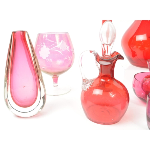 198 - A collection of vintage 20th-century studio art glass pieces, in red, purple, and cranberry. Featuri... 