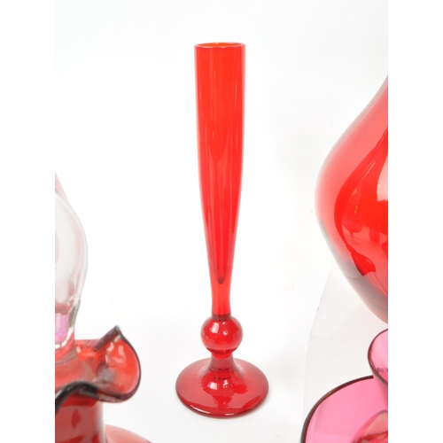 198 - A collection of vintage 20th-century studio art glass pieces, in red, purple, and cranberry. Featuri... 