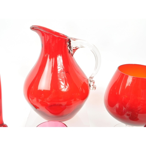 198 - A collection of vintage 20th-century studio art glass pieces, in red, purple, and cranberry. Featuri... 