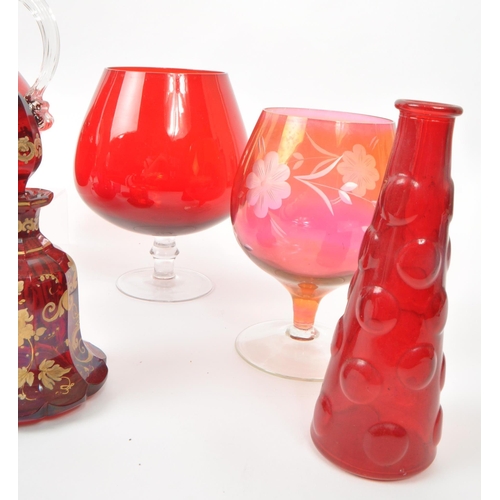 198 - A collection of vintage 20th-century studio art glass pieces, in red, purple, and cranberry. Featuri... 