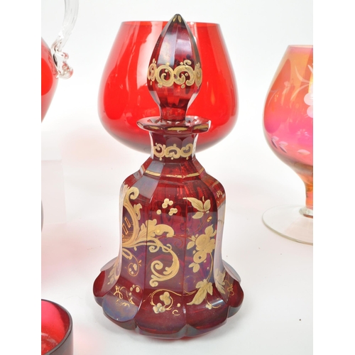 198 - A collection of vintage 20th-century studio art glass pieces, in red, purple, and cranberry. Featuri... 