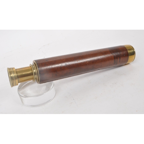 201 - A vintage 20th century brass 3-draw telescope, with leather covering to the handle. Measuring approx... 