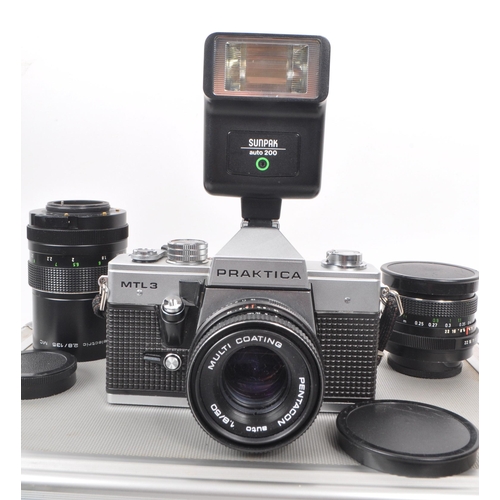 202 - 



A Praktica MTL3 Pentacon camera body together with lenses and in protective case along with acce... 