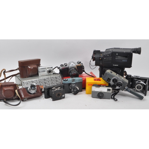 205 - A large collection of vintage cameras, including binoculars and video camera. Featuring makers such ... 