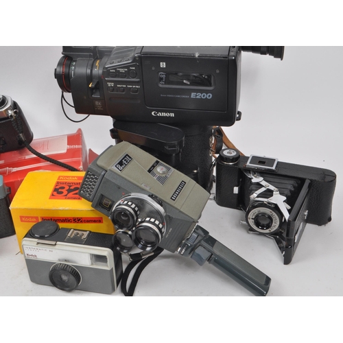 205 - A large collection of vintage cameras, including binoculars and video camera. Featuring makers such ... 