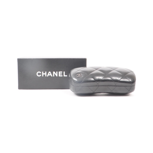 208 - A Chanel black glasses case, with the original box, drawstring bag and paperwork. Measuring approx. ... 