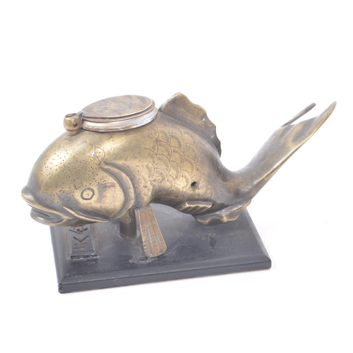 210 - An early 20th century Japanese brass inkwell, in the shape of a fish mounted on a wooden base. Inkwe... 