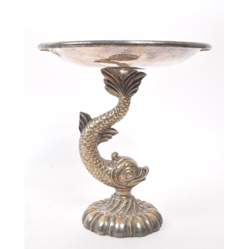 213 - A late 19th century brass silver plate Cutajar Works Malta tazza stand, featuring a fish shaped mari... 