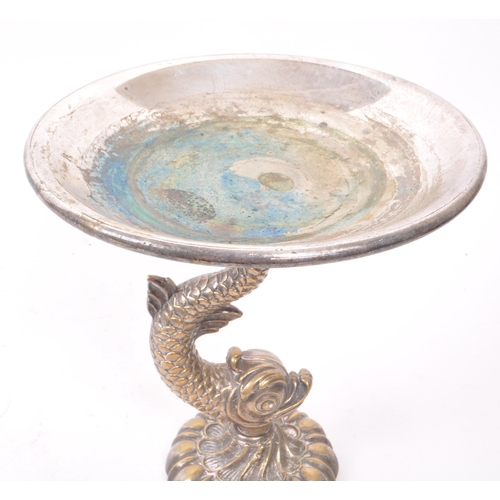 213 - A late 19th century brass silver plate Cutajar Works Malta tazza stand, featuring a fish shaped mari... 