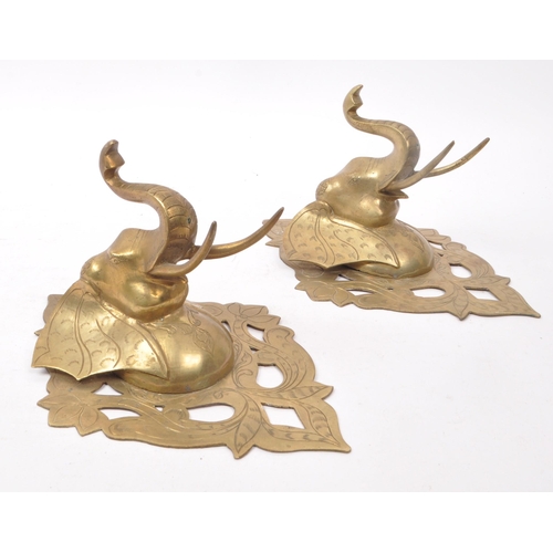 214 - Two vintage 20th century brass elephant sconces, with carved detailing featuring floral shapes and e... 