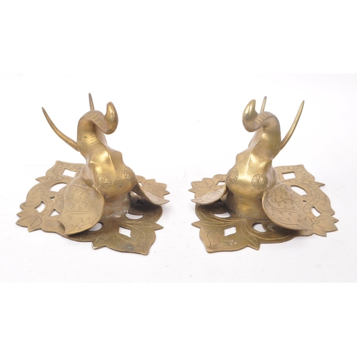 214 - Two vintage 20th century brass elephant sconces, with carved detailing featuring floral shapes and e... 