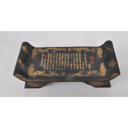 219 - A vintage 20th century Chinese pillow / writing table. Featuring a black stone base, and hand-painte... 