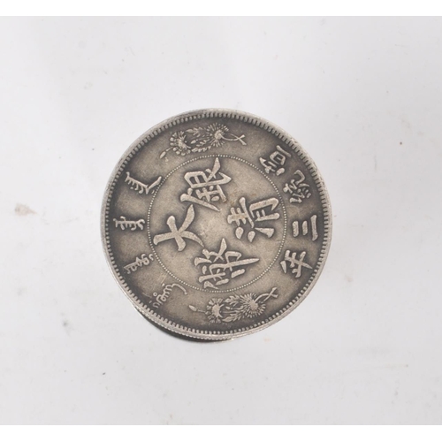 220 - A vintage 20th century Chinese fat man coin style cylindrical box. With a fat man coin style piece o... 