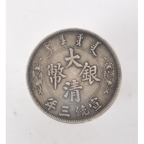 220 - A vintage 20th century Chinese fat man coin style cylindrical box. With a fat man coin style piece o... 