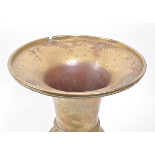 221 - A vintage 18th century brass Chinese spittoon, with a bublous lower body and flared top. Measuring a... 