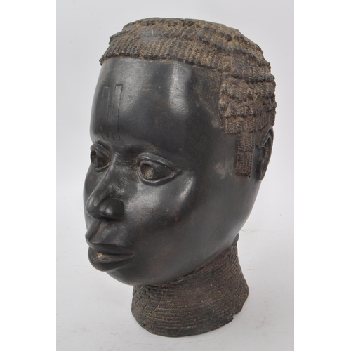 225 - A vintage early 20th century bronze metal African tribal bust, of a woman. Hollow to the inside of t... 