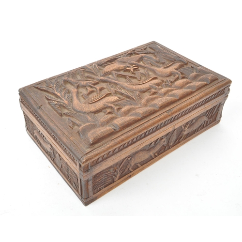 233 - Two vintage 20th century carved wooden boxes, one with carved tropical animals and plants, and the o... 