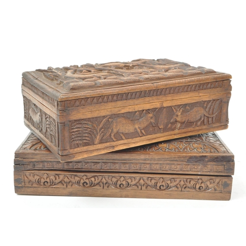 233 - Two vintage 20th century carved wooden boxes, one with carved tropical animals and plants, and the o... 