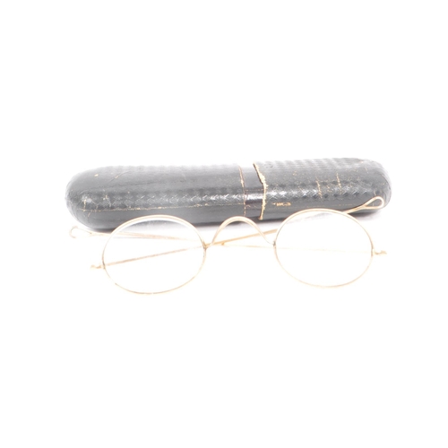 236 - A collection of three early 20th century gilt framed eye glasses. Each pair in original case.