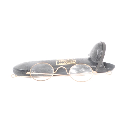 236 - A collection of three early 20th century gilt framed eye glasses. Each pair in original case.