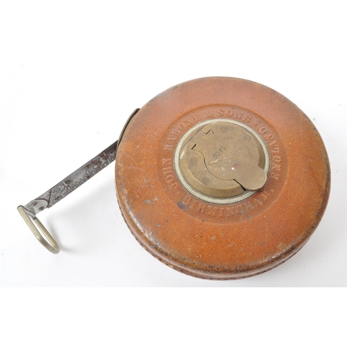 238 - A set of two vintage 1960s leather cased surveyor tape measures, one by John Rabone & Sons, Birm... 