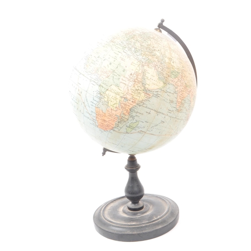 241 - Philips - A mid 20th century Philips British Empire desk top globe. The globe raised on a turned woo... 