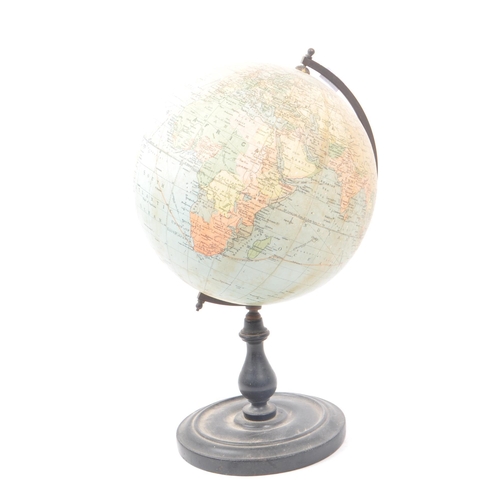 241 - Philips - A mid 20th century Philips British Empire desk top globe. The globe raised on a turned woo... 