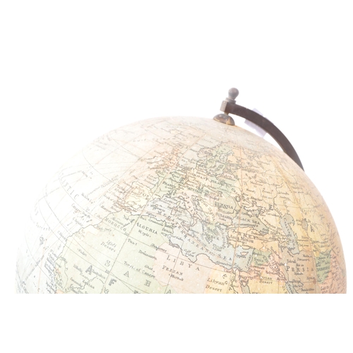 241 - Philips - A mid 20th century Philips British Empire desk top globe. The globe raised on a turned woo... 